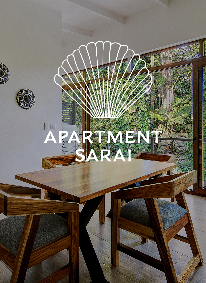 Table in the living room of the apartment sarai with a view of the tropical garden