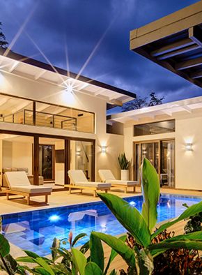 Villa with private pool, sun loungers, and direct access to the bedroom