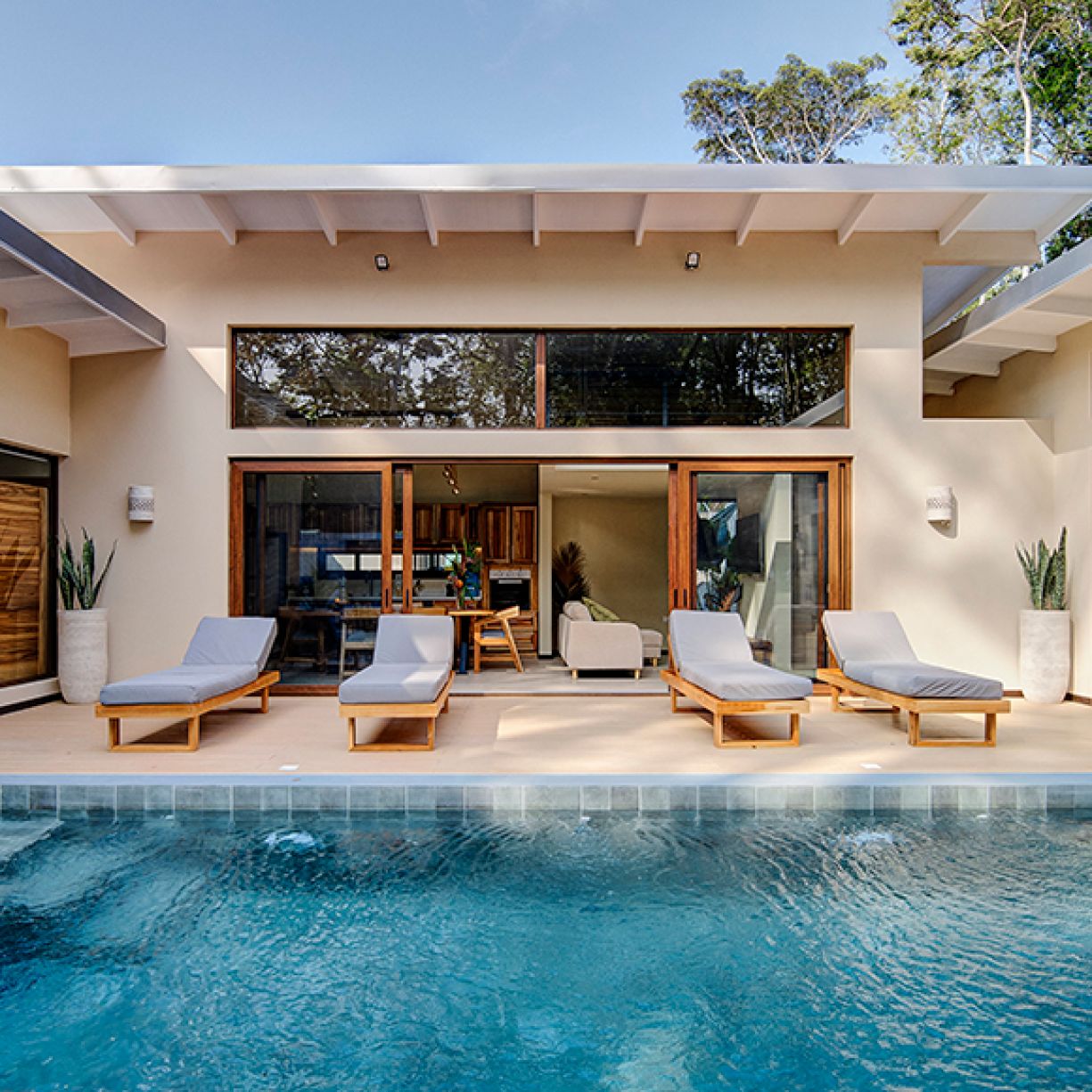 Outdoor pool with sun loungers